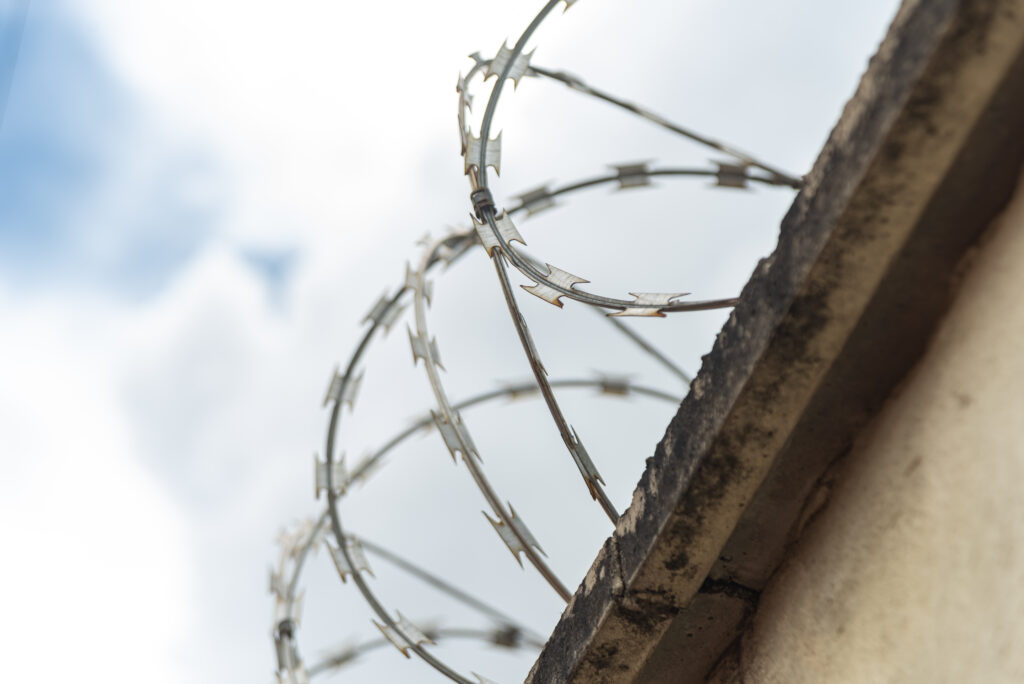 a security fence around a house emphasizing the power of setting boundaries